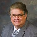 Dr. Larry  Thomas MD FICS FACS